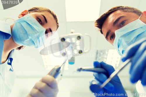 Image of close up of dentist and assistant at dental clinic