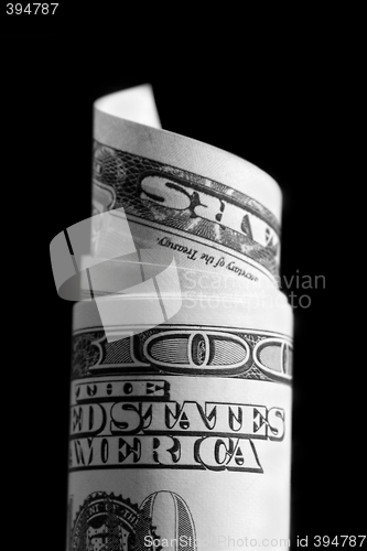Image of  rolled up 100 dollar bill