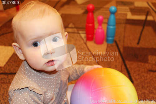 Image of little baby with a ball in perplexity