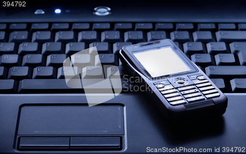 Image of Laptop and Mobile Phone