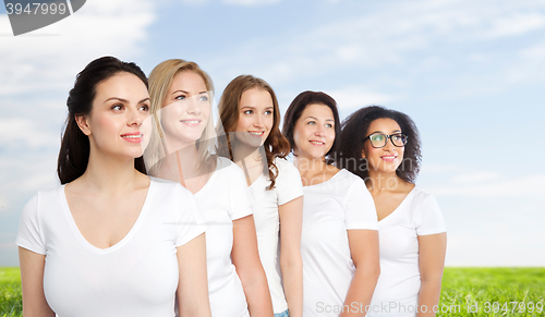 Image of group of happy different women in white t-shirts