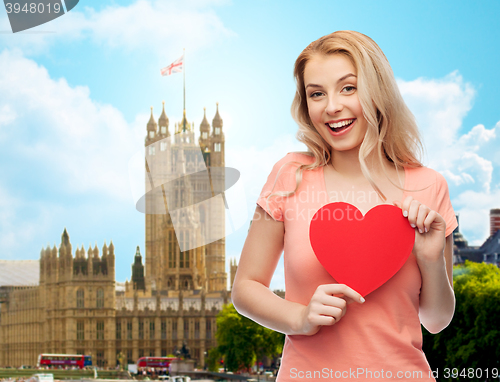 Image of happy woman or teen girl with red heart shape