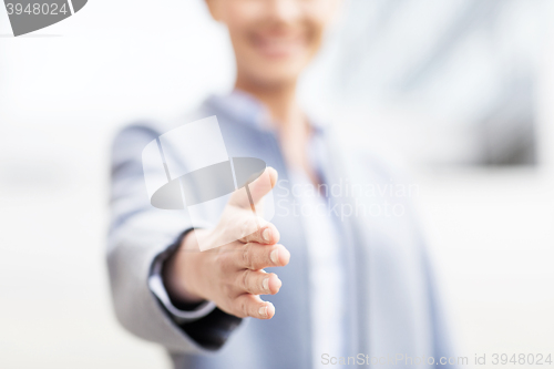 Image of close up of woman giving hand for handshake