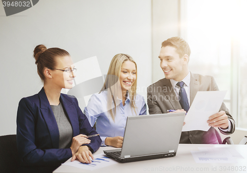 Image of business team with laptop having discussion