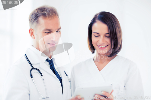 Image of two doctors looking at tablet pc