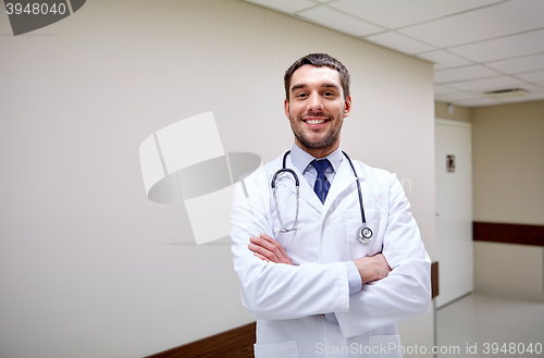 Image of smiling doctor with stethoscope at hospital 