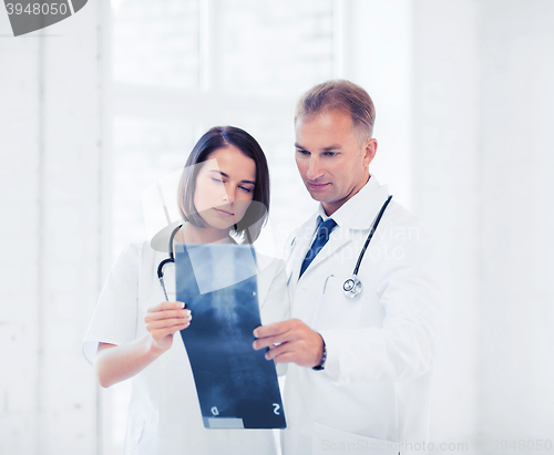 Image of two doctors looking at x-ray