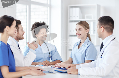 Image of group of happy doctors meeting at hospital office