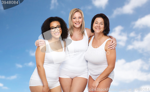 Image of group of happy plus size women in white underwear