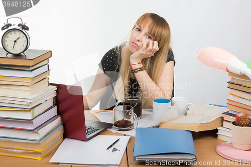 Image of Student doing at night drinking a lot of coffee cups all wanted to sleep well