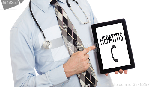 Image of Doctor holding tablet - Hepatitis C