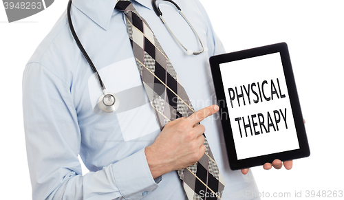 Image of Doctor holding tablet - Physical therapy