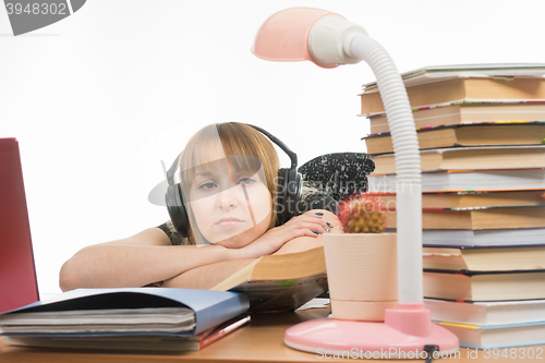 Image of Student tired sad looking at a cactus