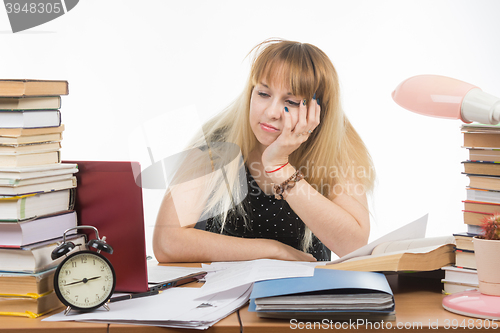 Image of Upset Applicant sad looking at a laptop which saw not enrolled in school