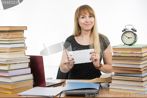 Image of She has prepared an envelope with a bribe teachers for successfully completing the exam