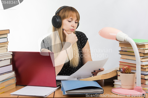 Image of Student thought reading the paper document