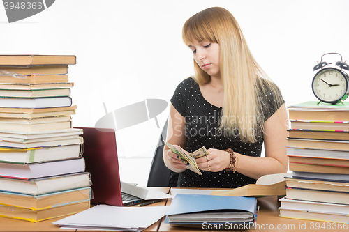 Image of The student considers the amount of bribes to pass the exam