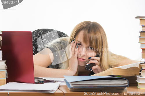 Image of Tired researcher is calling on the phone