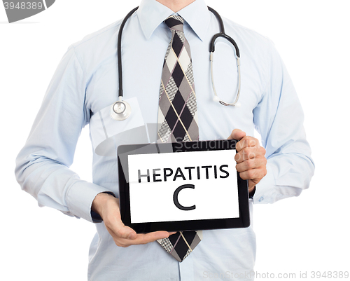 Image of Doctor holding tablet - Hepatitis C