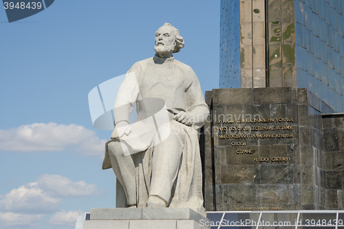 Image of Moscow, Russia - August 10, 2015: Monument to Konstantin Tsiolkovsky and the inscription on the monument at the foot of the obelisk \"Conquerors of Space\" in Moscow