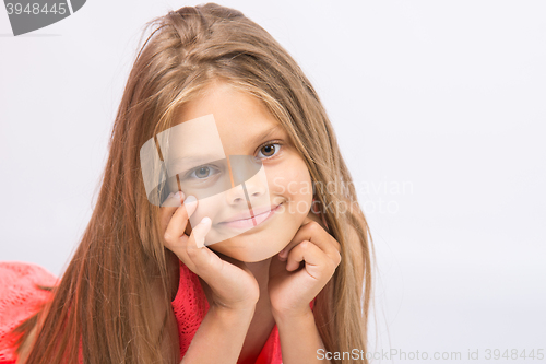 Image of Portrait of a seven-year cheerful little girl on a white background