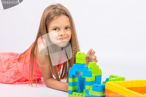 Image of Seven-year girl builds a house from the block designer
