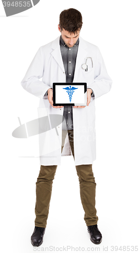 Image of Doctor holding tablet - Caduceus symbol