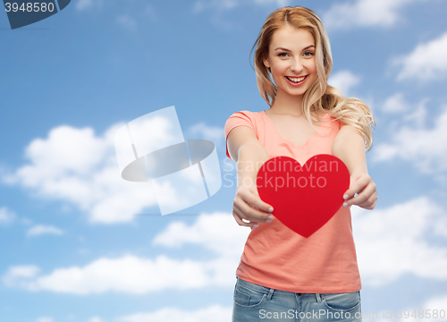 Image of happy woman or teen girl with red heart shape