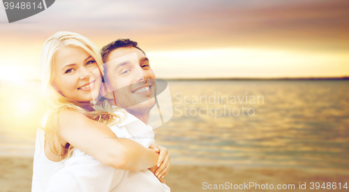 Image of couple having fun on the beach