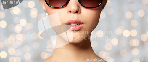 Image of close up of beautiful woman in black sunglasses