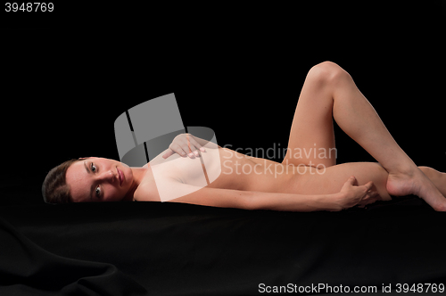 Image of sensual nude woman on black background