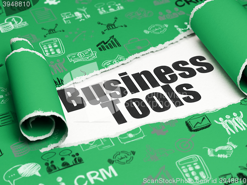 Image of Finance concept: black text Business Tools under the piece of  torn paper