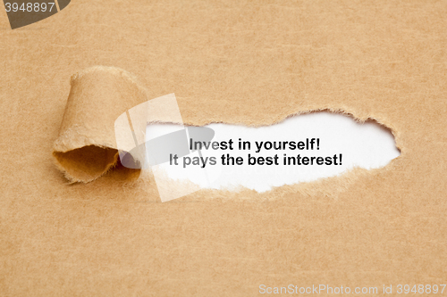 Image of Invest In Yourself Quote Ripped Paper Concept