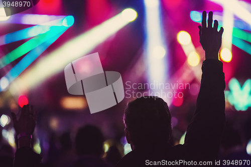 Image of festival visitor silhouette in front of mainstage