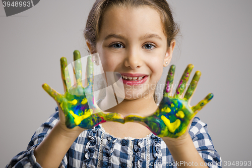 Image of Little girl with hands in paint