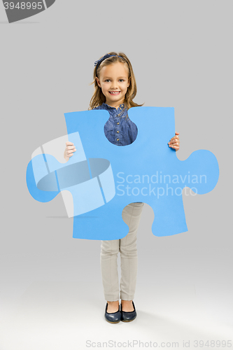 Image of Girl holding a puzzle