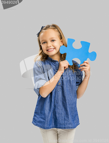 Image of Girl holding a puzzle