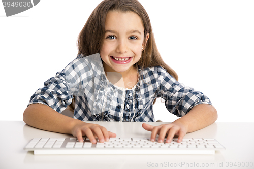 Image of Little girl working with a computer