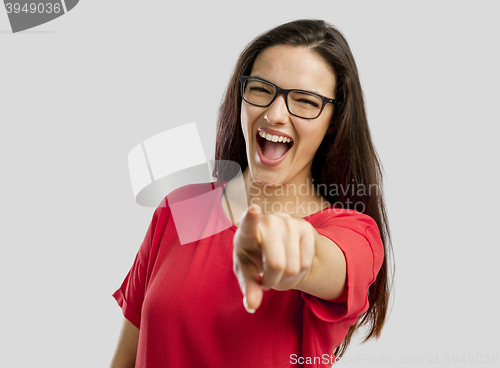 Image of Happy woman pointing to the camera