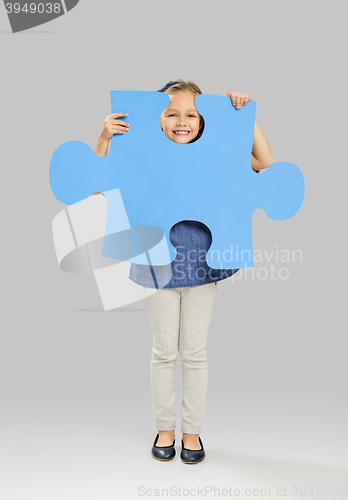 Image of Girl holding a puzzle