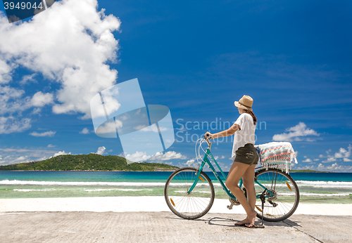 Image of Woman ride along The Beach