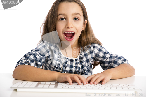 Image of Little girl working with a computer