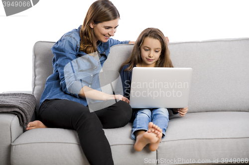 Image of Mother teaching her little daughter