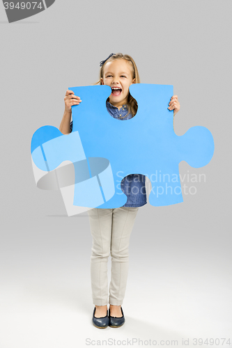 Image of Girl holding a puzzle