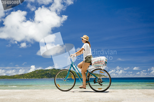 Image of Woman ride along The Beach