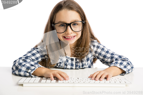 Image of Little girl working with a computer