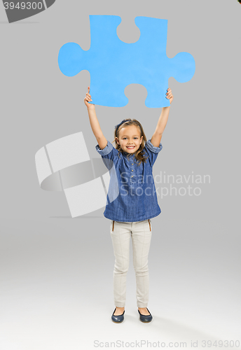 Image of Girl holding a puzzle