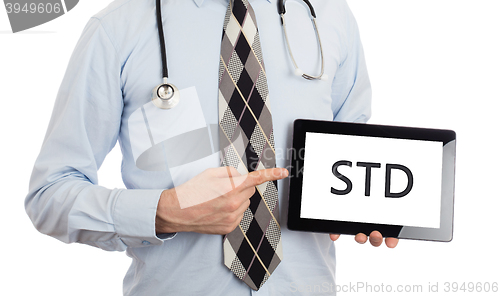 Image of Doctor holding tablet - STD