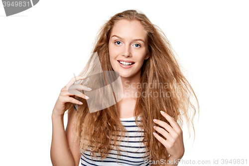 Image of Beautiful young woman with flying hair