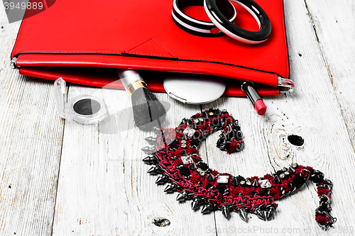 Image of Red clutch bag and ladies accessories